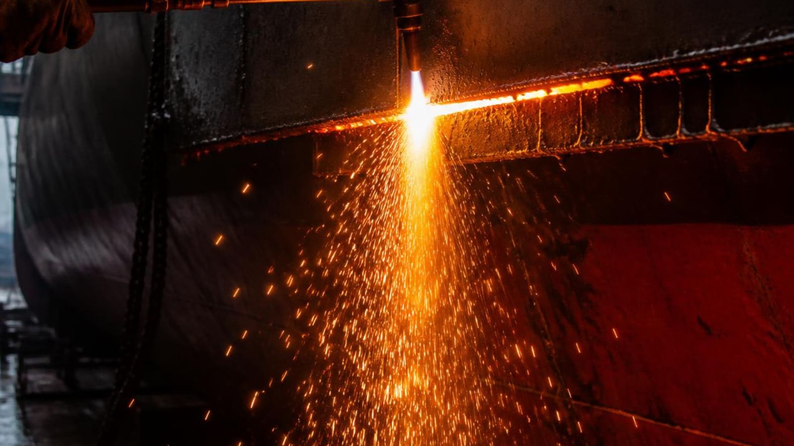 Steel plate being cut and fitted on a vessel under repair