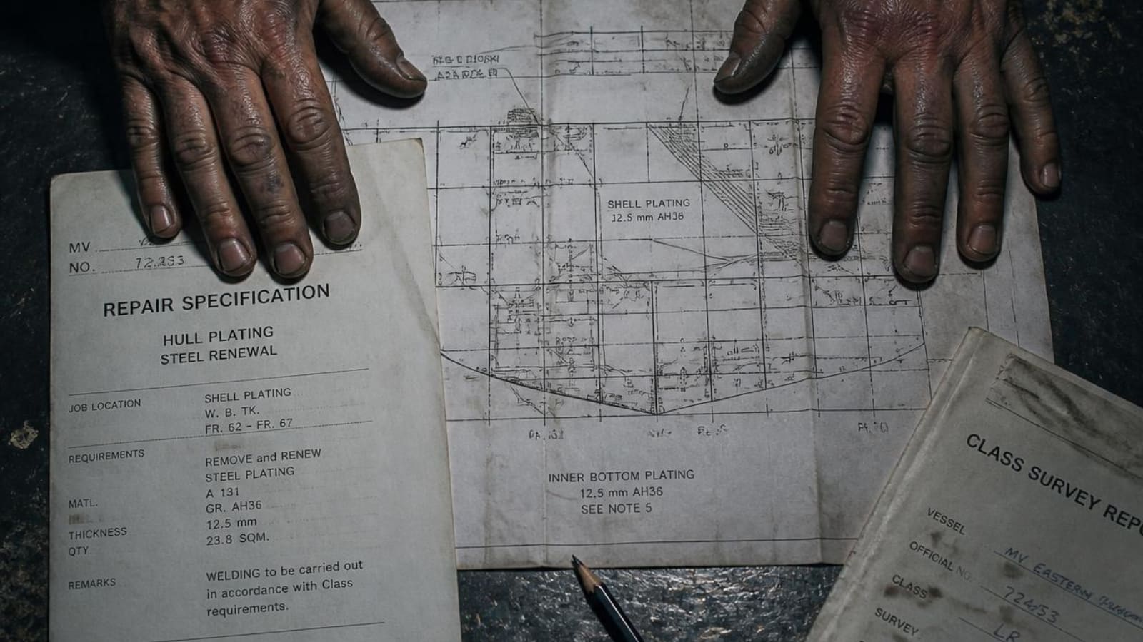 A repair specification, a hull plating drawing and a class survey report laid out on a steel surface